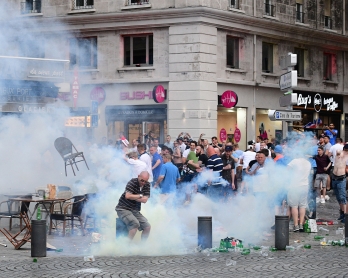 Tear gas is released by French police as England fans gather in Marseille, southern France, on June 10, 2016, ahead of England's Euro 2016 football match against Russia