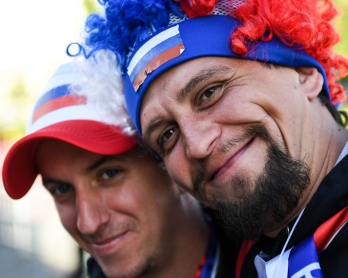 Russian fans pose for picture during the opening ceremony of the FIFA Fan Fest in Nizhny Novgorod on June 14, 2018, during the Russia 2018 World Cup