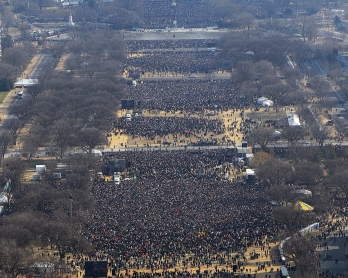 People gather on the National Mall in Washington, DC, to watch the inauguration of US President-elect Barack Obama as 44th US president January 20, 2009. 